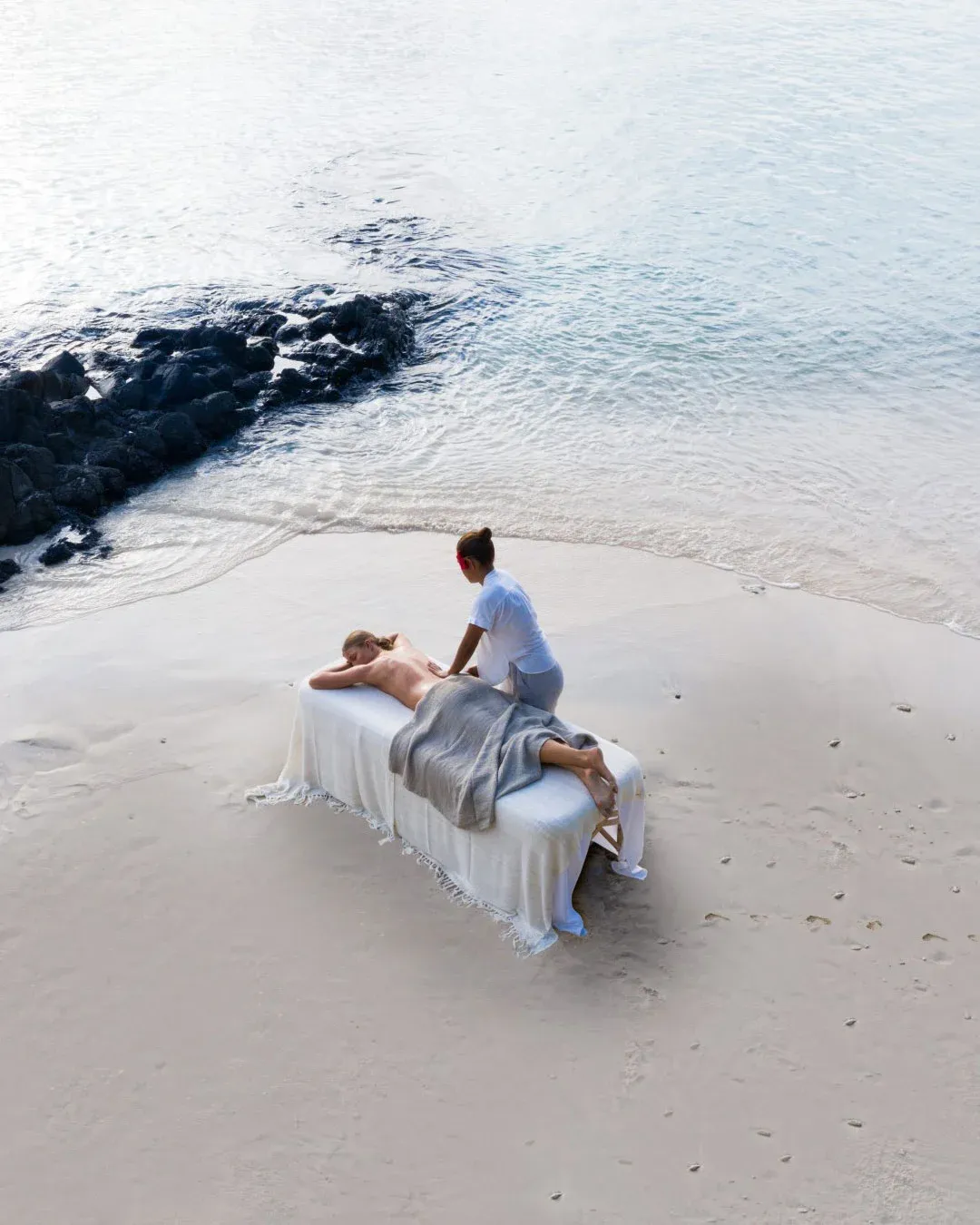 Massage on a white-sand beach