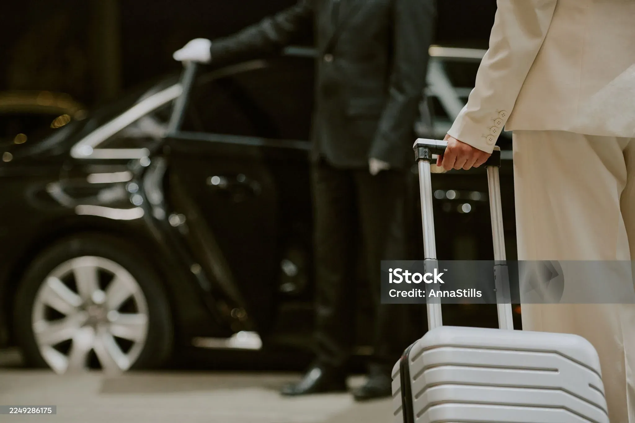 Luggage being loaded into a private car