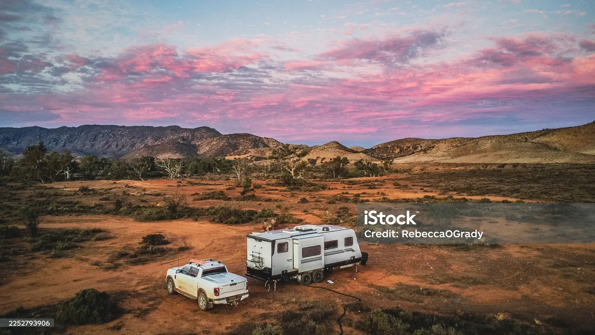 Vehicles parked at dusk