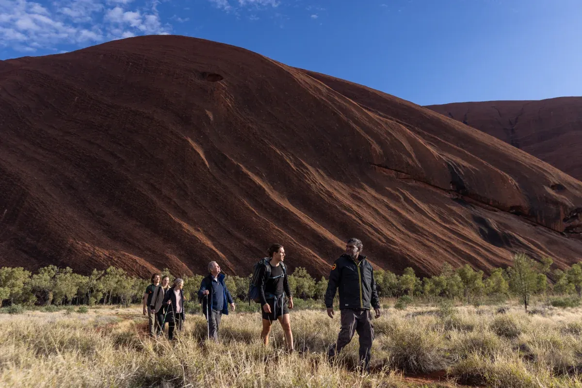 Guests walking towards Uluru